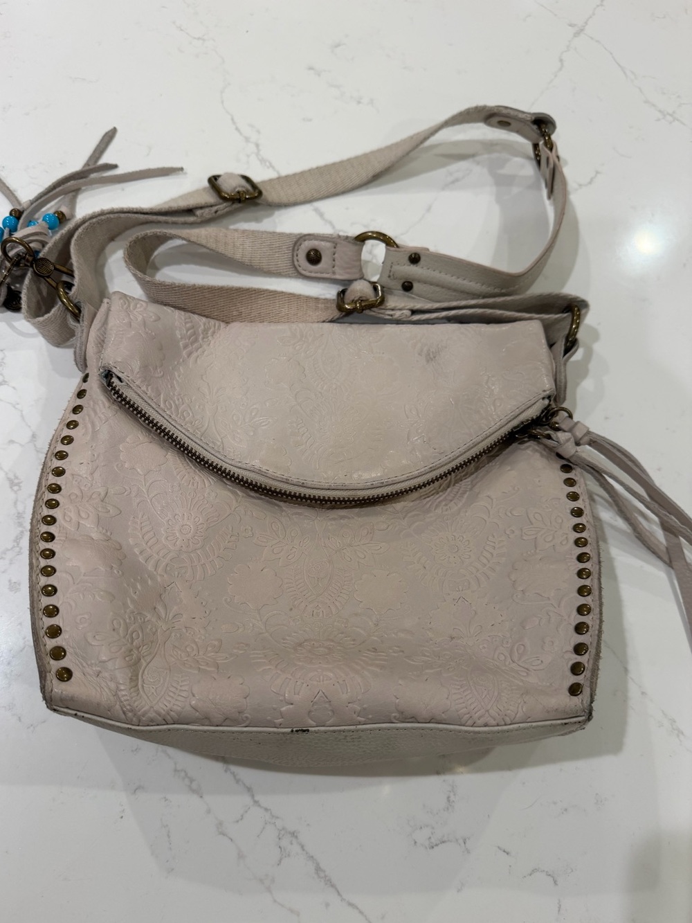 The Sak Neutral Embossed Crossbody Bag with Stud Detail